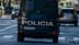 Rear view of a police van with the word 'Policia' on the back, driving on a city street. - Olive Oil Times