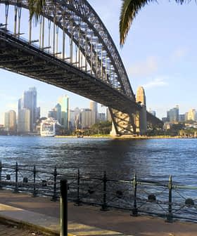 Sydney Harbour Bridge spanning over the water with the city skyline in the background. - Olive Oil Times