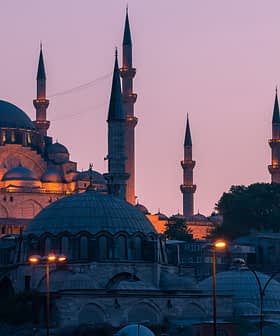 A view of a mosque in Istanbul with multiple minarets during dusk, illuminated by soft lighting. - Olive Oil Times