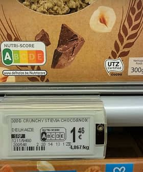 Nutri-Score label displayed on food packaging in a supermarket aisle. - Olive Oil Times